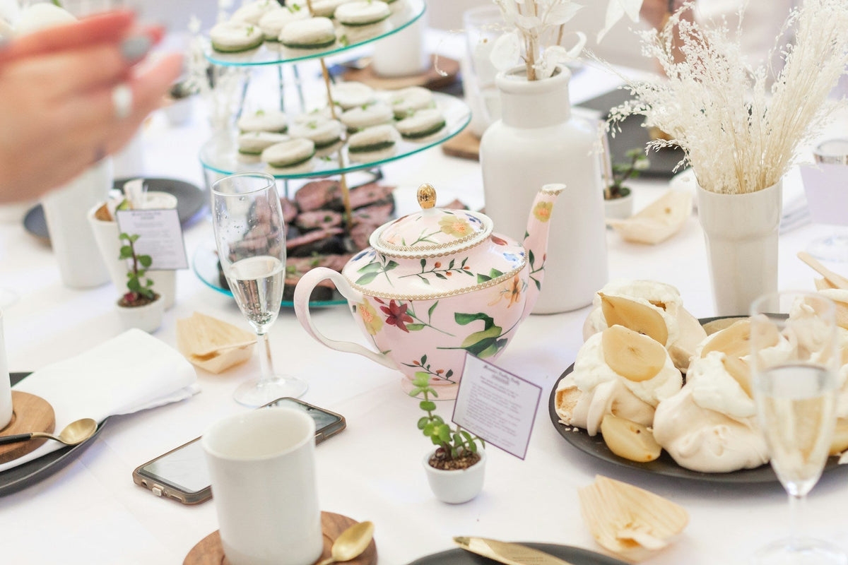 English tea time with teapot and desserts