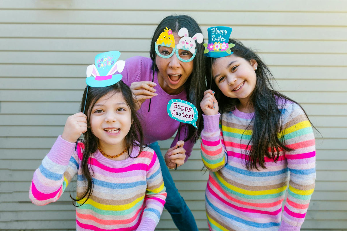 a mother and her daughters celebrating Easter